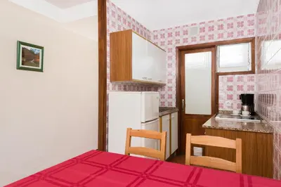 Una cocina o zona de cocina en Apartamentos las Góndolas