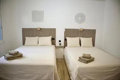 Cama o camas de una habitación en Modern Flat 6 pax Las Canteras