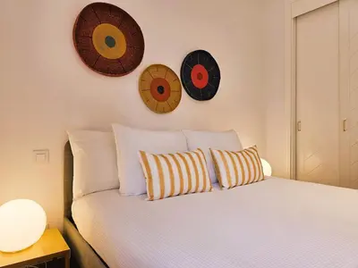 Cama o camas de una habitación en Stylish & cozy home by the beach