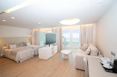 Cama o camas de una habitación en Hotel Sahara Playa