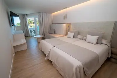 Cama o camas de una habitación en Hotel Sahara Playa