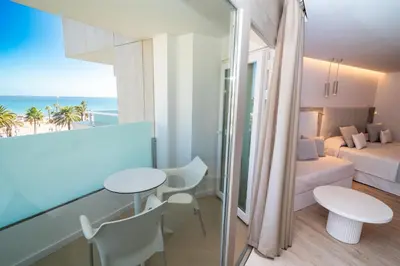 Cama o camas de una habitación en Hotel Sahara Playa
