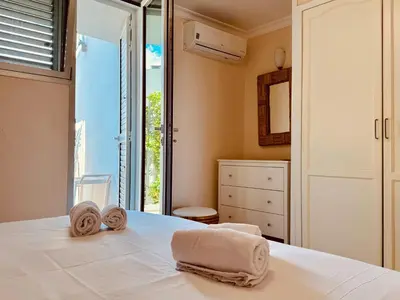 Cama o camas de una habitación en Apartamentos las Rocas 9