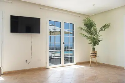 Una televisión o centro de entretenimiento en Casa Mia Monte León