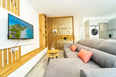 Una televisión o centro de entretenimiento en Bello Horizonte Playa de las Canteras