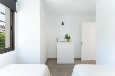 Cama o camas de una habitación en Apartamentos Romandie by Saratur