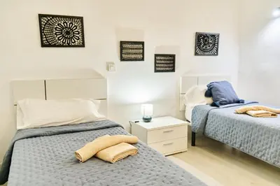 Cama o camas de una habitación en Buenavista Las Canteras