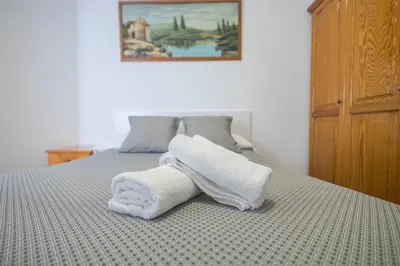Cama o camas de una habitación en Apartamentos L O L A Arguineguin