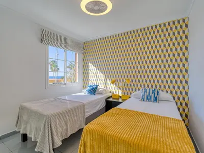Cama o camas de una habitación en Timon Beach Suites San Agustin
