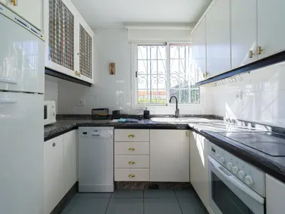 Una cocina o zona de cocina en Timon Beach Suites San Agustin