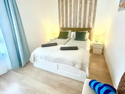 Cama o camas de una habitación en OceanEye Apartment with heated pool