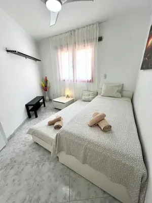 Cama o camas de una habitación en Quiet Corner by the Beach