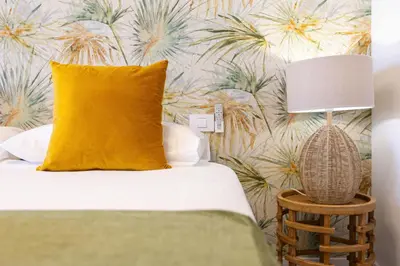 Cama o camas de una habitación en Apartamento frente a la playa de Las Canteras S1