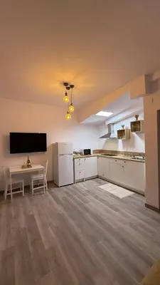 Una televisión o centro de entretenimiento en Sweet Loft La Garita