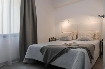 Cama o camas de una habitación en Income Spain Apartamentos
