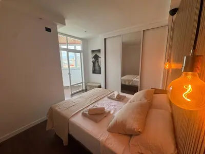 Cama o camas de una habitación en Apartamento con vistas al mar piso 16 y a 5 min de la playa de Las Canteras CASA CARMELA