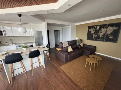 Zona de estar de Apartamento con vistas al mar piso 16 y a 5 min de la playa de Las Canteras CASA CARMELA