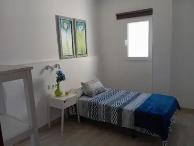 Cama o camas de una habitación en La Casita de Cheny