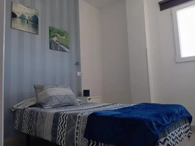Cama o camas de una habitación en La Casita de Cheny