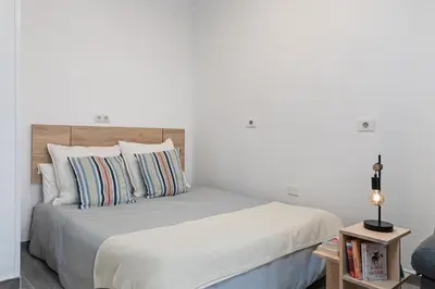 Cama o camas de una habitación en Home2Book City & Beach Studio Las Palmas