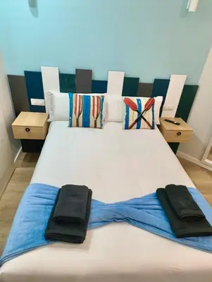 Cama o camas de una habitación en EL FARo