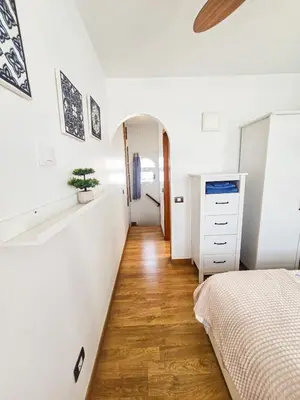 Cama o camas de una habitación en Playmar - Casa Sol dúplex soleado