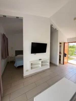 Una televisión o centro de entretenimiento en Secret Bungalow, Los Arcos