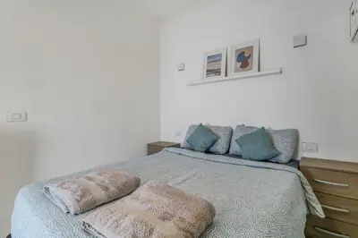 Cama o camas de una habitación en Leo's House Las Canteras 1BR