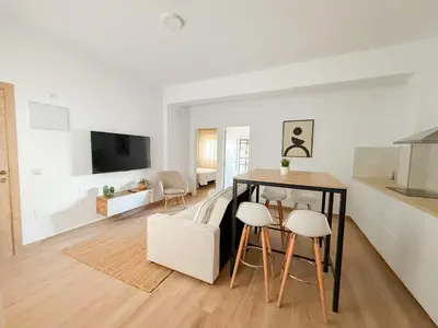 Una televisión o centro de entretenimiento en City Beach Las Canteras