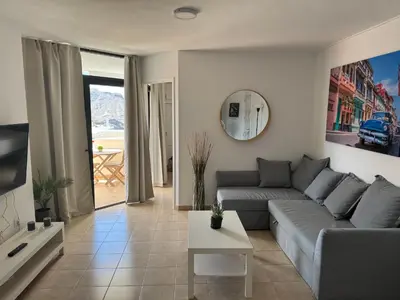 Una televisión o centro de entretenimiento en Apartamento Victoria