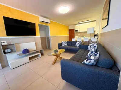 Una televisión o centro de entretenimiento en Iguazu 2 bedroom apartment