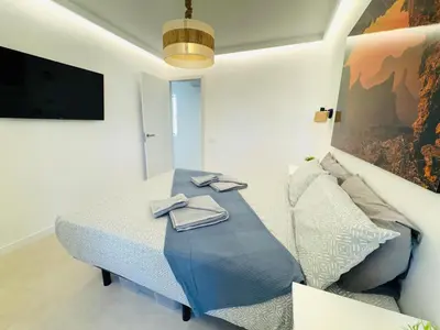 Una televisión o centro de entretenimiento en Bungalow Diana