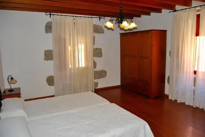 Cama o camas de una habitación en Casa Rural Los Suárez