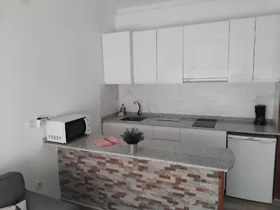 Una cocina o zona de cocina en Las Dunas - Playa del Ingles