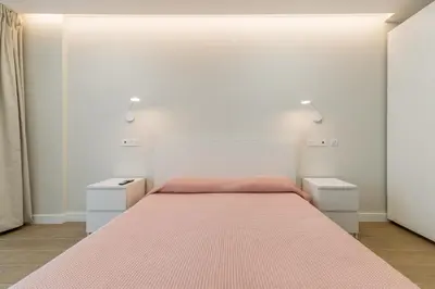 Cama o camas de una habitación en M&M SUITE AGAETE PARQUE by HOMESTAYGRANCANARIA