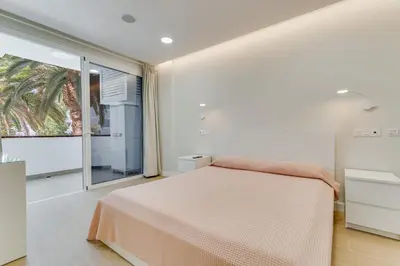 Cama o camas de una habitación en M&M SUITE AGAETE PARQUE by HOMESTAYGRANCANARIA