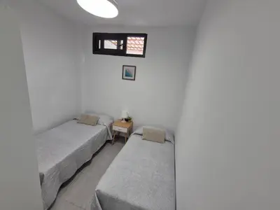 Cama o camas de una habitación en Beach Home - Las Canteras