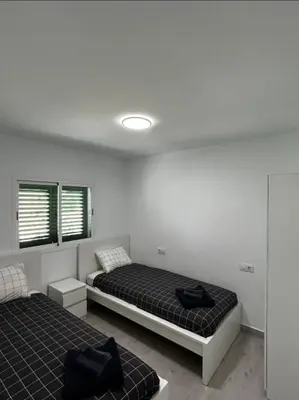 Cama o camas de una habitación en Beach life only 5 minutes away and Heated pool