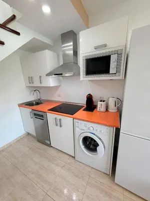 Una cocina o zona de cocina en Oasis Maspalomas Dunaflor Verde