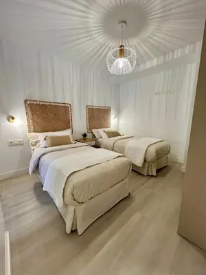 Cama o camas de una habitación en New and cozy apartment next to the beach