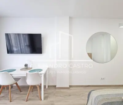 Una televisión o centro de entretenimiento en Elegance Canteras Suite