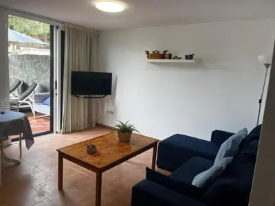 Una televisión o centro de entretenimiento en Oasis de paz junto al mar