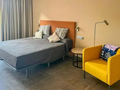 Cama o camas de una habitación en GREEN VIEW by HOMESTAYGRANCANARIA