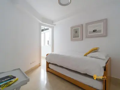 Cama o camas de una habitación en Living Las Canteras Homes - Beachside Spa Parking