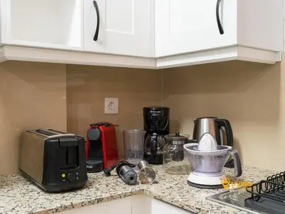 Una cocina o zona de cocina en Living Las Canteras Homes - Beachside Spa Parking
