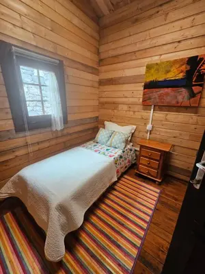 Cama o camas de una habitación en CABAÑA Mirador de las Lagunetas
