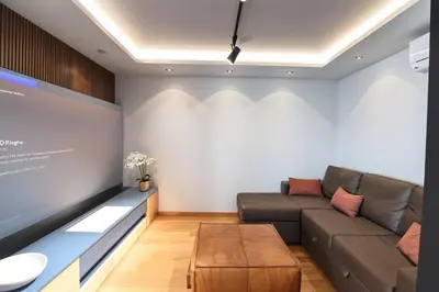 Una televisión o centro de entretenimiento en Apartamento Luxury a pie de playa
