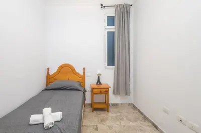Cama o camas de una habitación en GuestReady - La Suerte cerca Los Alisios