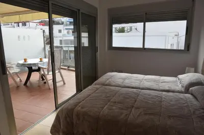 Cama o camas de una habitación en Alojamiento en Playa de Mogán