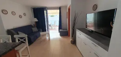 Una televisión o centro de entretenimiento en Alojamiento en Playa de Mogán